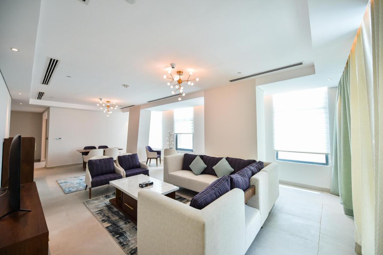 Waterfront Hotel Apartment Lusail Exterior foto A living room in a suite at the Ritz-Carlton, DIFC